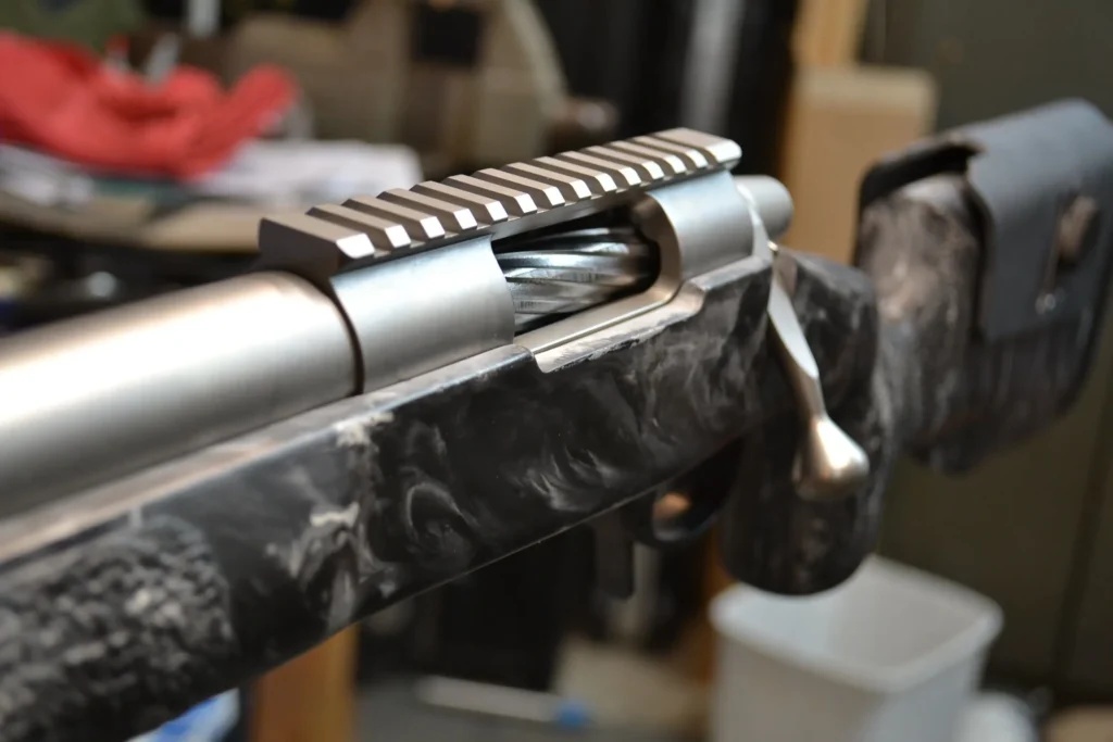 Glass-bedded rifle action in a stock