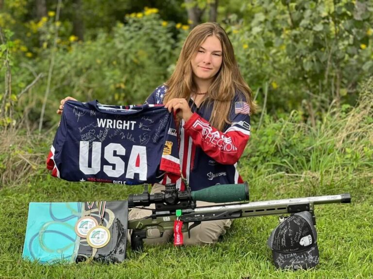 Dakota Wright with her Team USA jersey and her Rachel Precision rifle