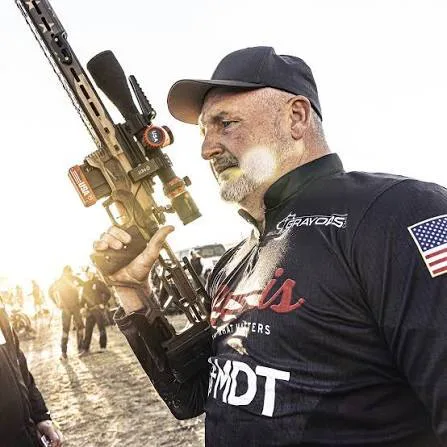 Dave Ostrowske holding his rifle at a match