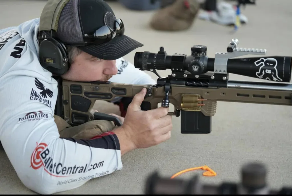 Nathan Cushman shooting prone behind his rifle at a match