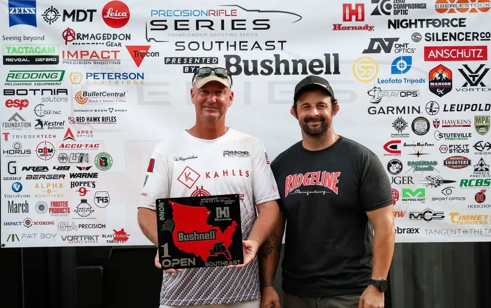 Cole Higginbotham in a Rachel Precision jersey holding a first-place Open plaque at a PRS Southeast match
